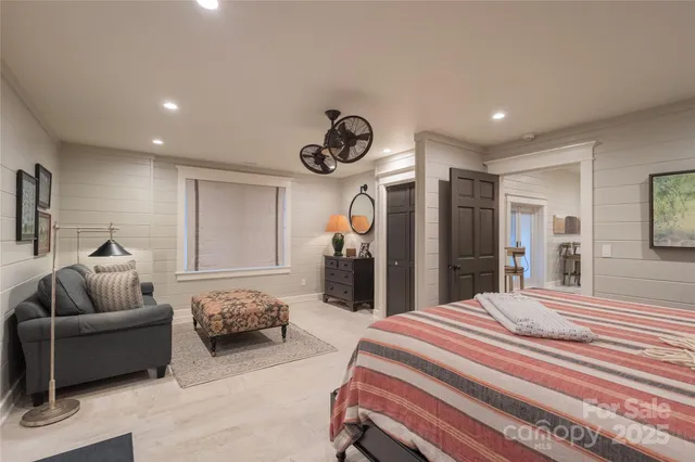 a spacious bedroom with a bed and furniture