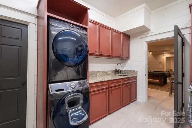 a view of a kitchen with washer and dryer
