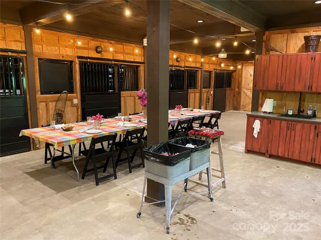a backyard of a house with table and chairs