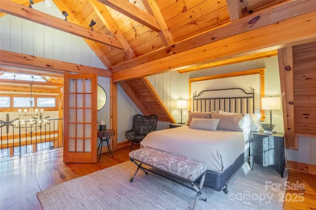 a view of a grassy field with mountains in the background