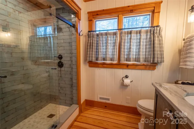 a view of a green field with a tree