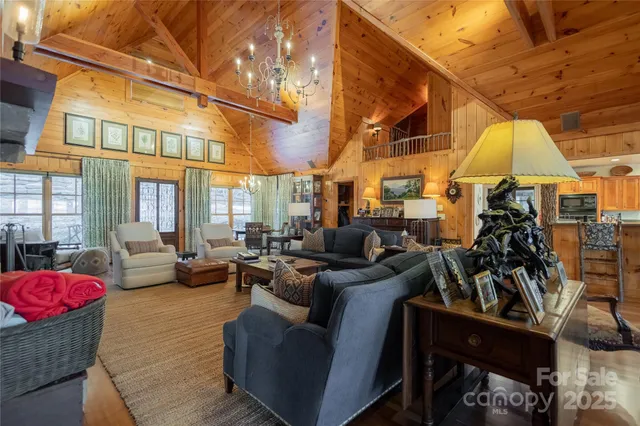 a living room with lots of furniture and a chandelier
