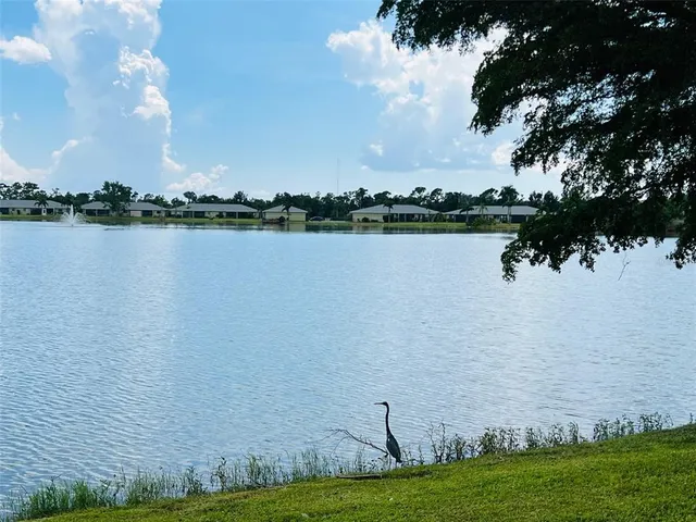 a view of a backyard with sitting area