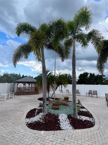 a view of a swimming pool with an outdoor seating