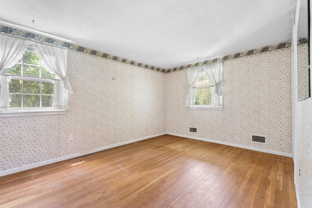 348 Belknap Road Framingham, MA 01701 - Photo 19 of 35 wooden floor in an empty room with a window