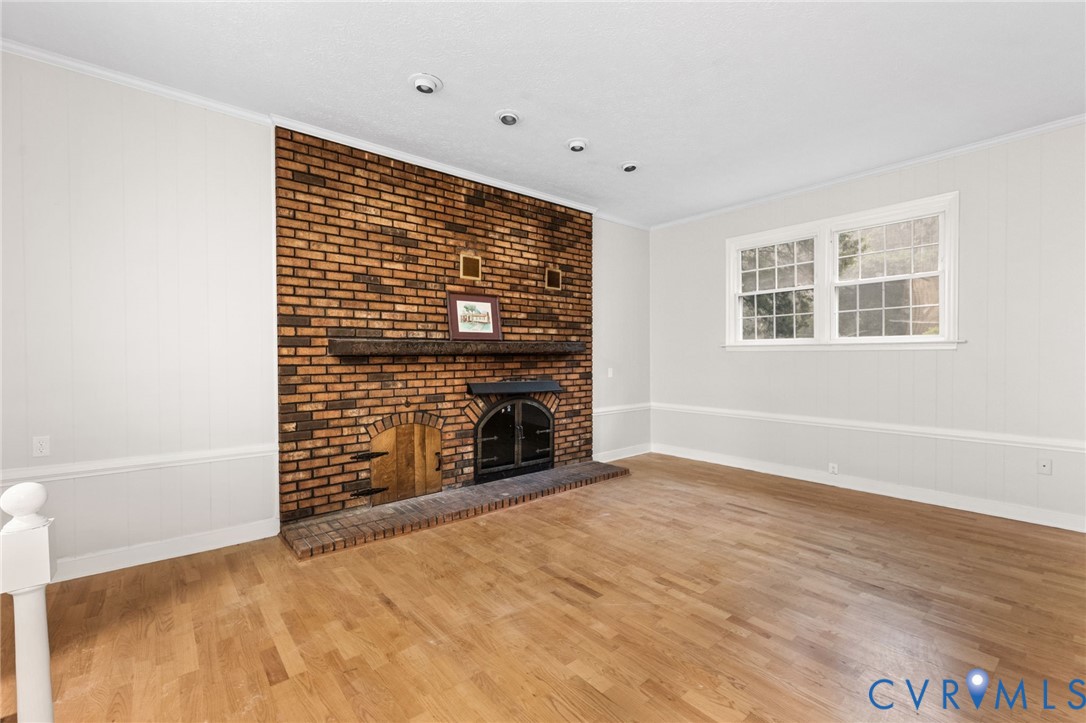 3151 Mountclair Road Chester, VA 23831 - Photo 33 of 36 Living area featuring a floor-to-ceiling brick fir