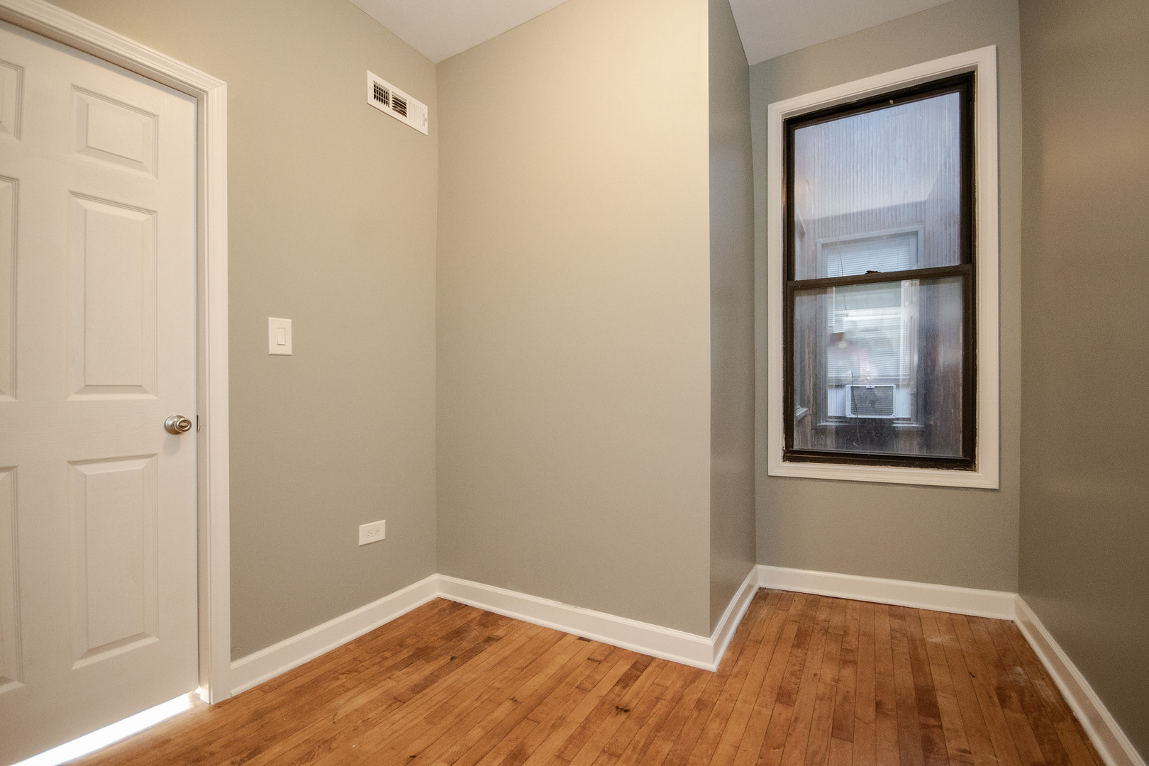 925 South Laflin Street, Unit 2R Chicago, IL 60607 - Photo 16 of 29 a view of an empty room with closet and wooden floor