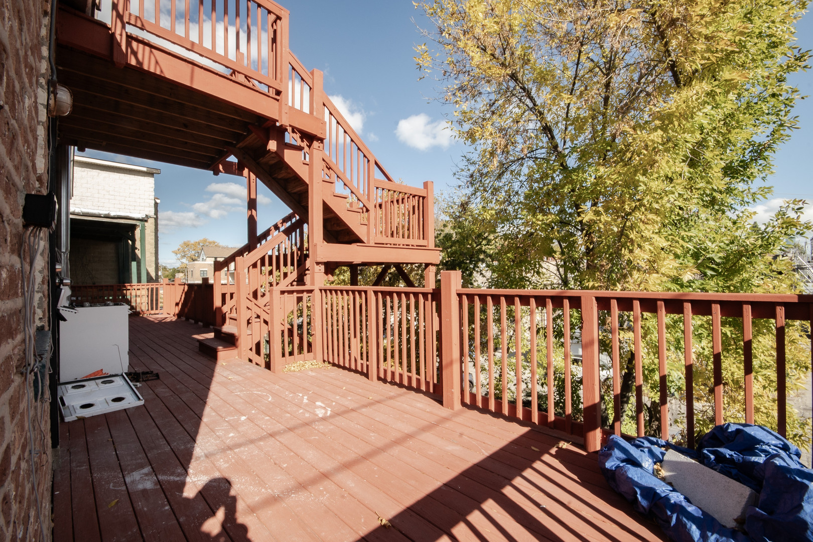 925 South Laflin Street, Unit 2R Chicago, IL 60607 - Photo 27 of 29 a balcony with chairs on wooden floor