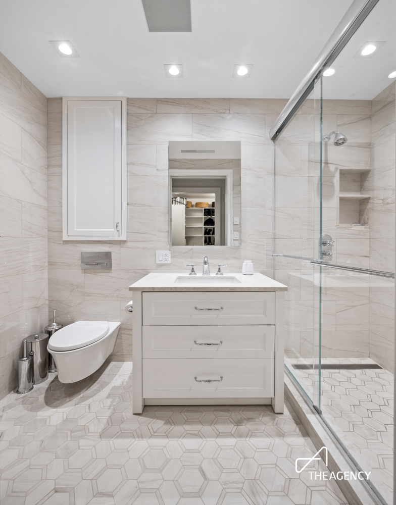 303 West 80th Street, Unit 2B1B Manhattan, NY 10024 - Photo 14 of 16 a bathroom with a sink a toilet and a mirror