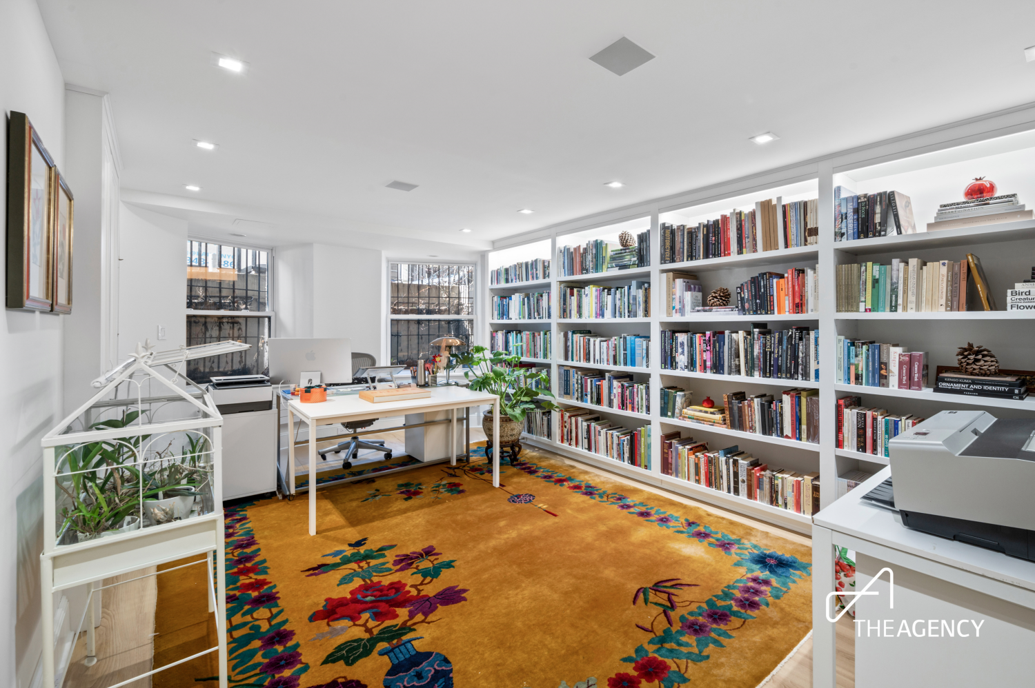 303 West 80th Street, Unit 2B1B Manhattan, NY 10024 - Photo 15 of 16 a living room with fireplace furniture and a book shelf