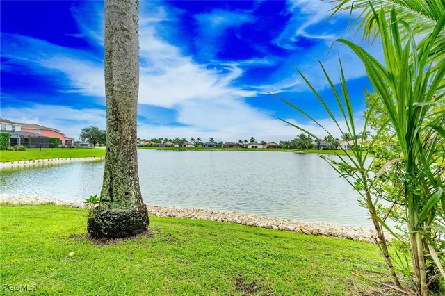 a view of a backyard with sitting area