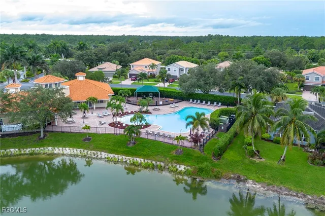an aerial view of a pool patio swimming pool and outdoor seating