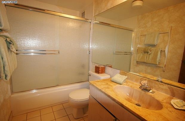 760 South Kihei Road, Unit 507 Kihei, HI 96753 - Photo 11 of 15 a bathroom with a granite countertop shower sink vanity and toilet