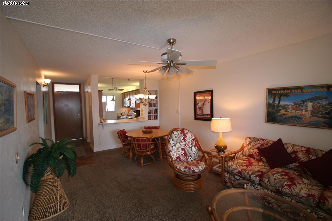 760 South Kihei Road, Unit 507 Kihei, HI 96753 - Photo 6 of 15 a living room with furniture flowerpot and a chandelier