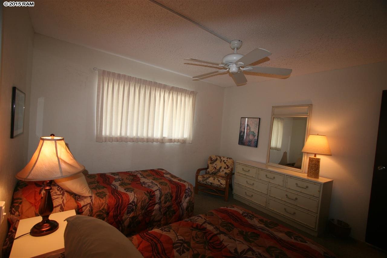 760 South Kihei Road, Unit 507 Kihei, HI 96753 - Photo 10 of 15 a bedroom with bed and a window