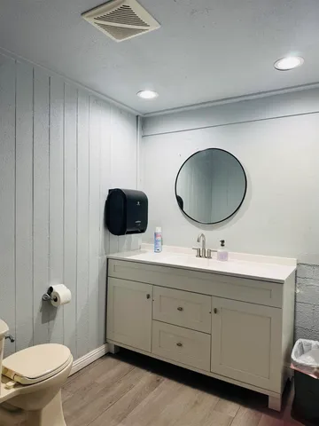 a view of a room with chairs and window