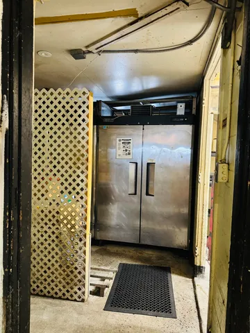 a stove top oven sitting inside of a kitchen