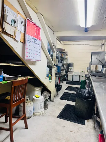 a bathroom with a shower and mirror