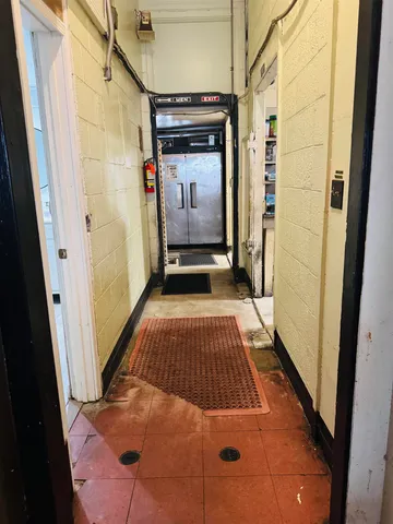 a view of a dining room with furniture wooden floor and chandelier