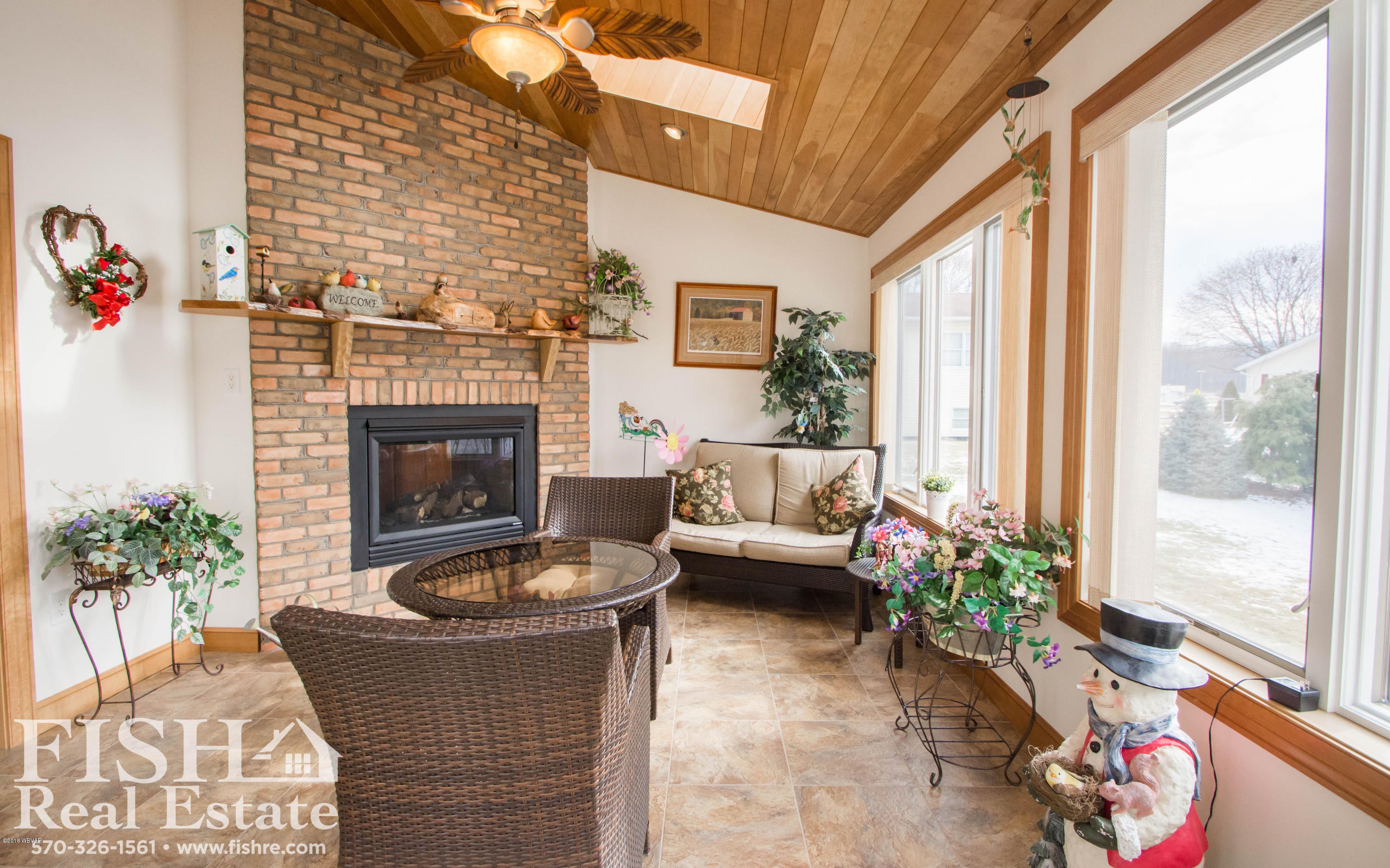 1220 Arthur Road Montoursville, PA 17754 - Photo 6 of 19 Sunroom/Fireplace view