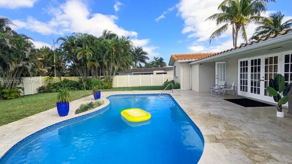 a view of a house with swimming pool