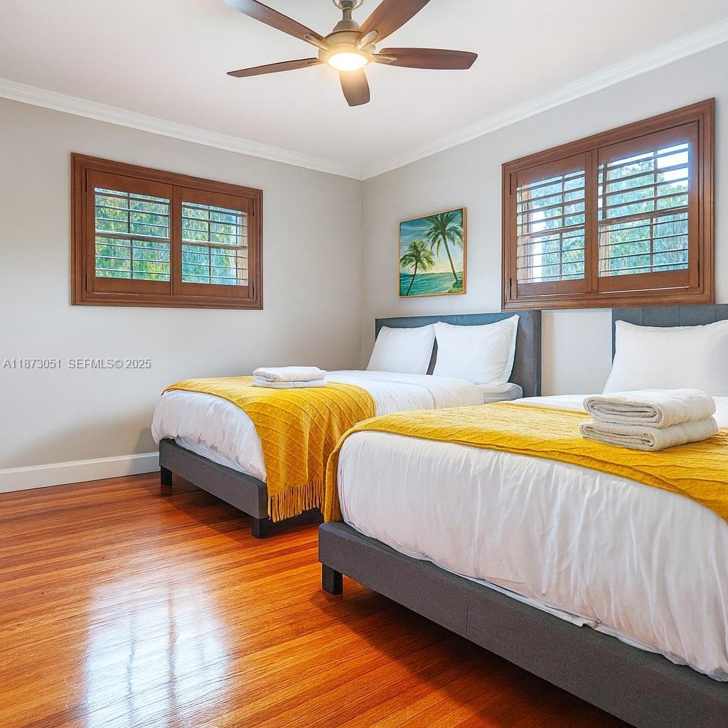 4027 Pierce Street Hollywood, FL 33021 - Photo 19 of 22 a bedroom with a bed and a window