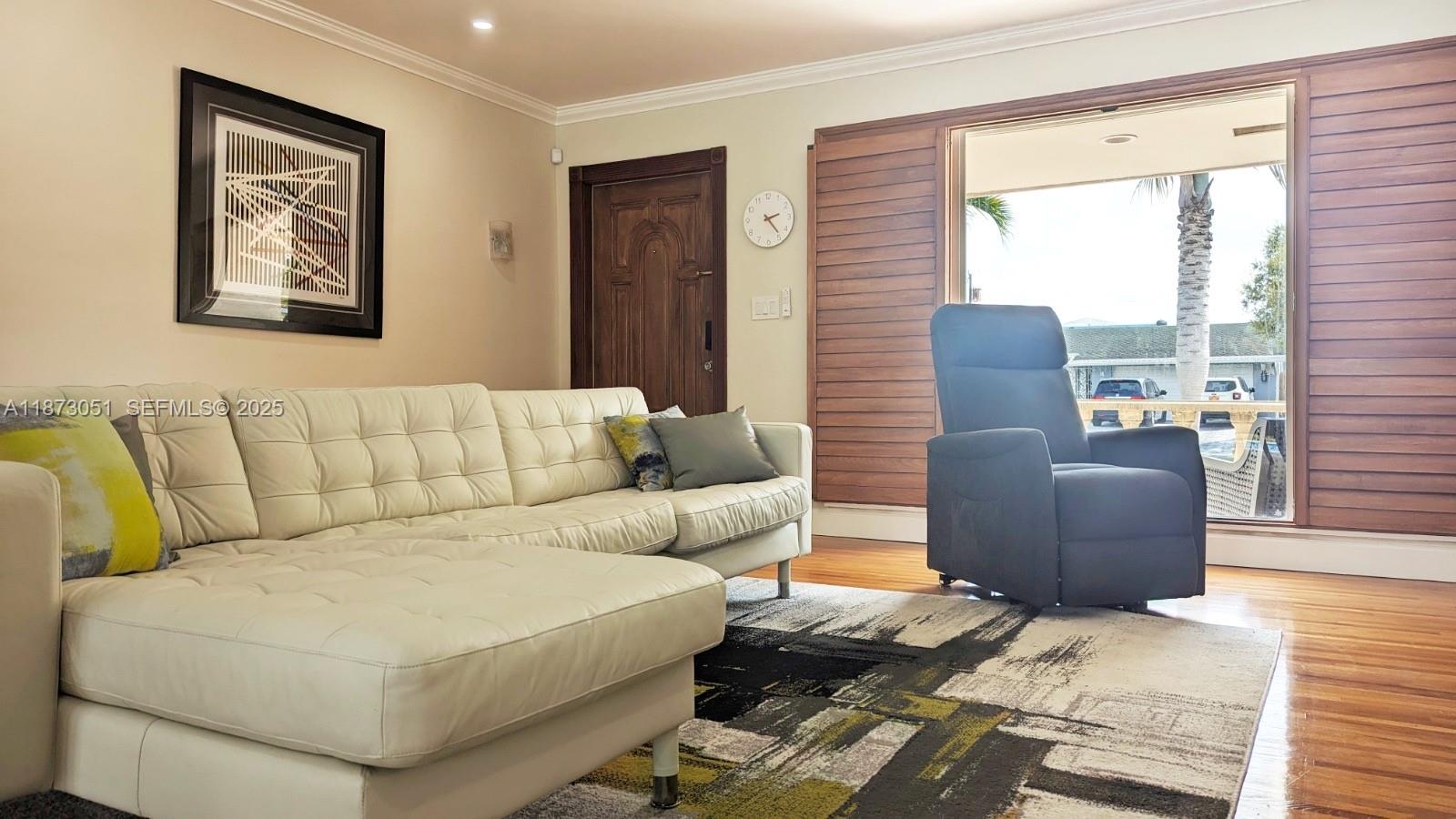 4027 Pierce Street Hollywood, FL 33021 - Photo 3 of 22 a living room with furniture and a window