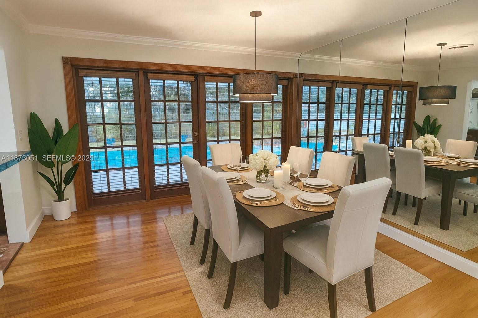 4027 Pierce Street Hollywood, FL 33021 - Photo 5 of 22 a view of a dining room with furniture window and wooden floor