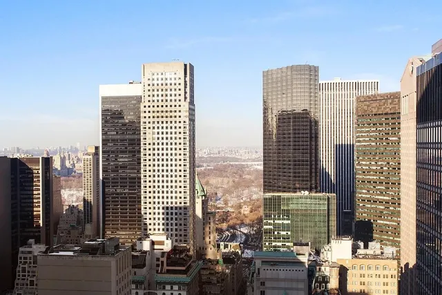 a front view of a building with city view