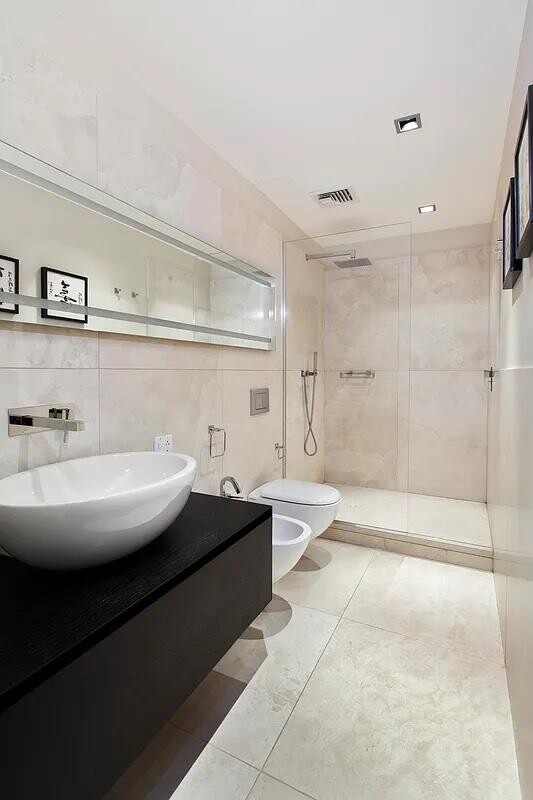 641 5th Avenue, Unit 38B Manhattan, NY 10022 - Photo 7 of 8 a view of bathroom with bathtub