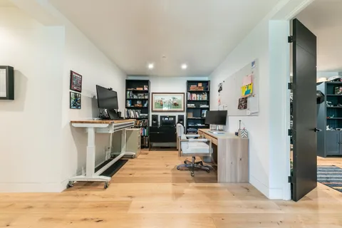 a view of a workspace with furniture and storage