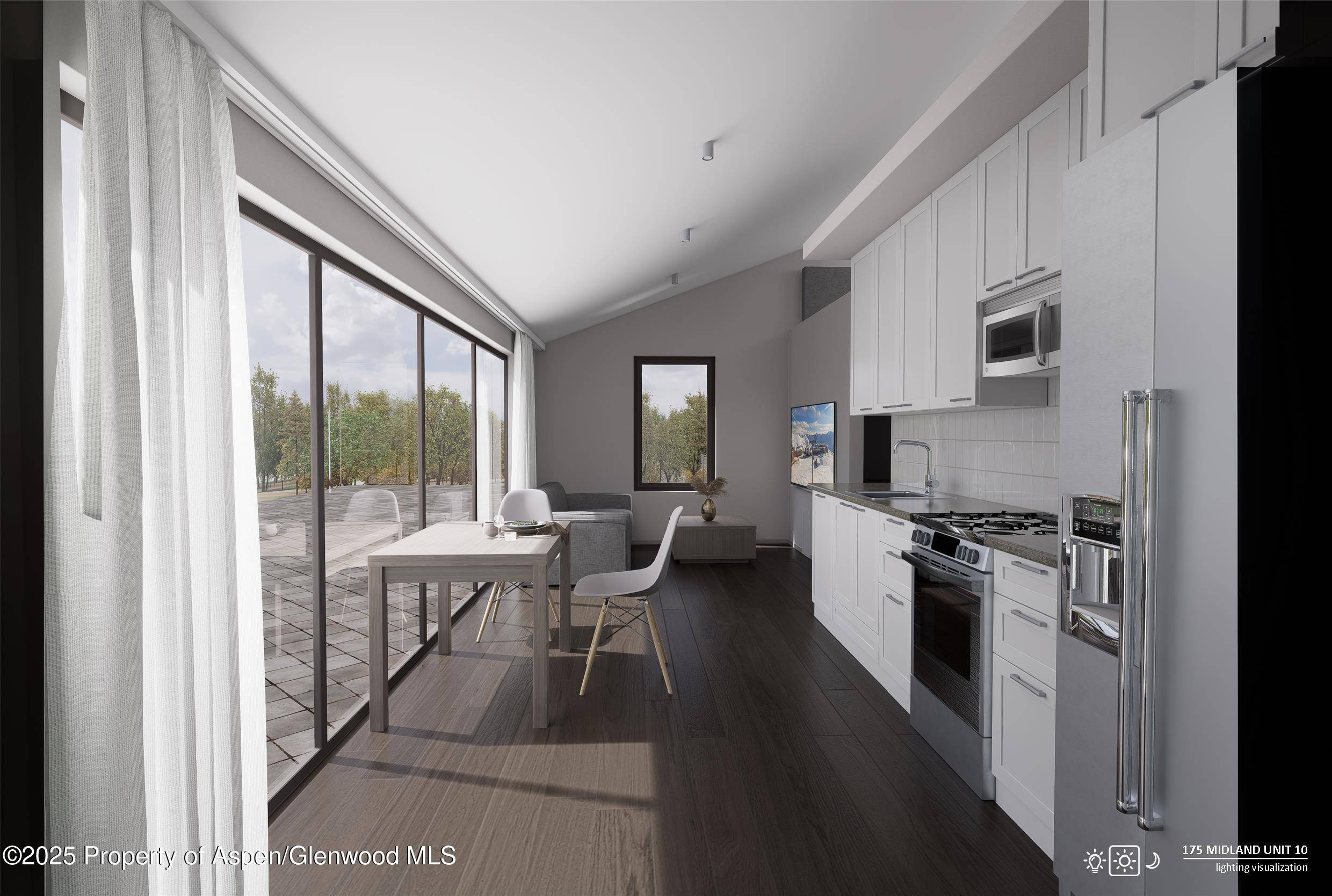 a kitchen with a table chairs refrigerator and cabinets