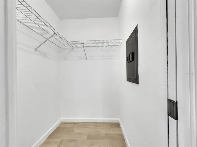 a view of empty room with ceiling fan