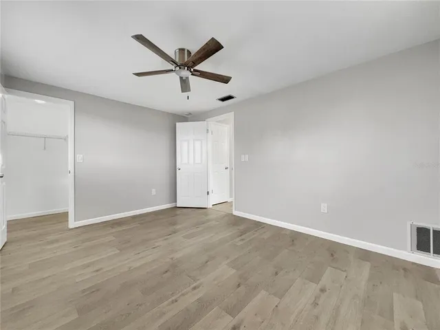 a house with pool in front of it