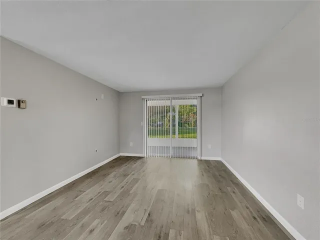 a view of room with window and hallway