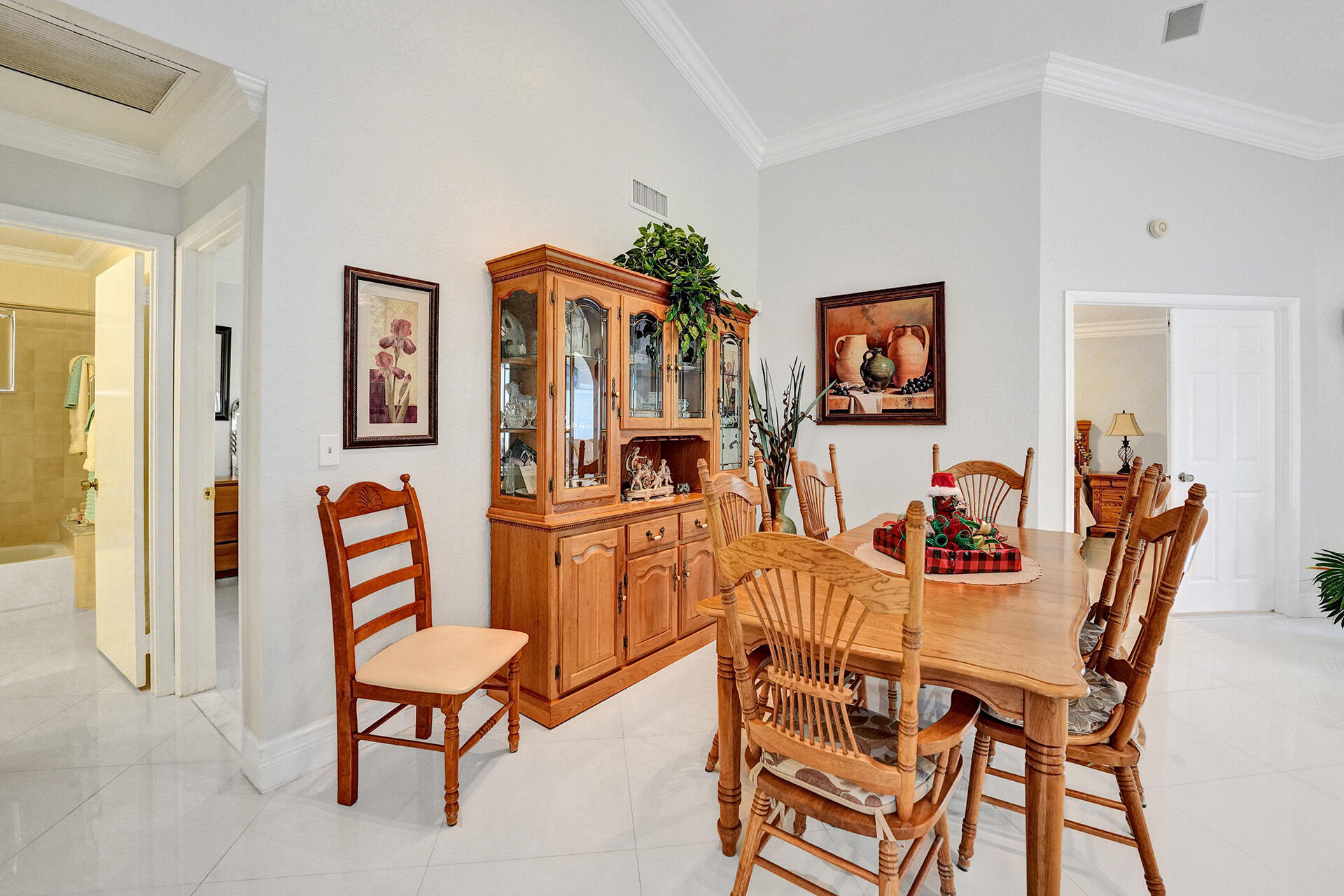 5447 Helene Circle Boynton Beach, FL 33472 - Photo 17 of 40 a dining room with furniture and window