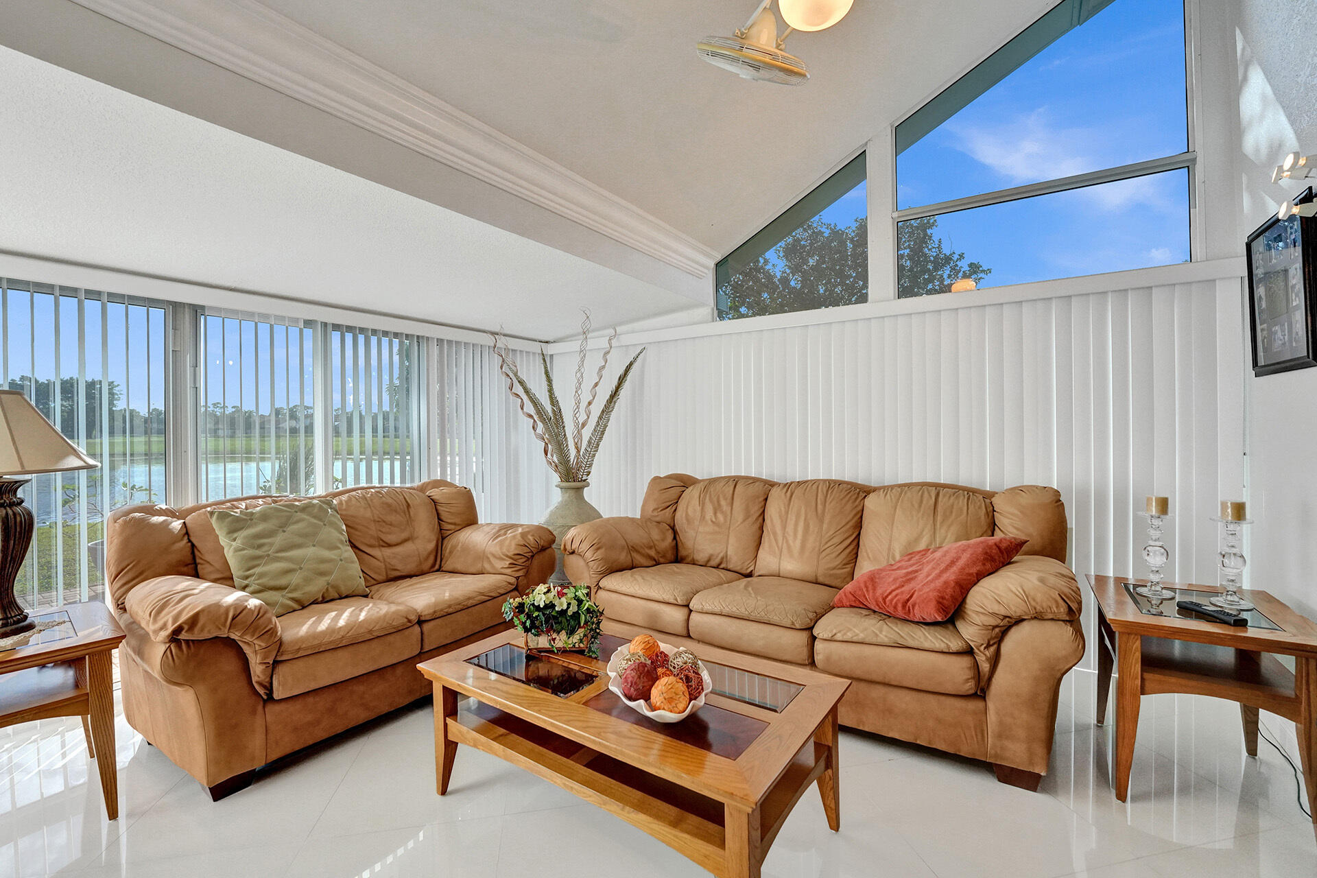 5447 Helene Circle Boynton Beach, FL 33472 - Photo 20 of 40 a living room with furniture a couch and a large window