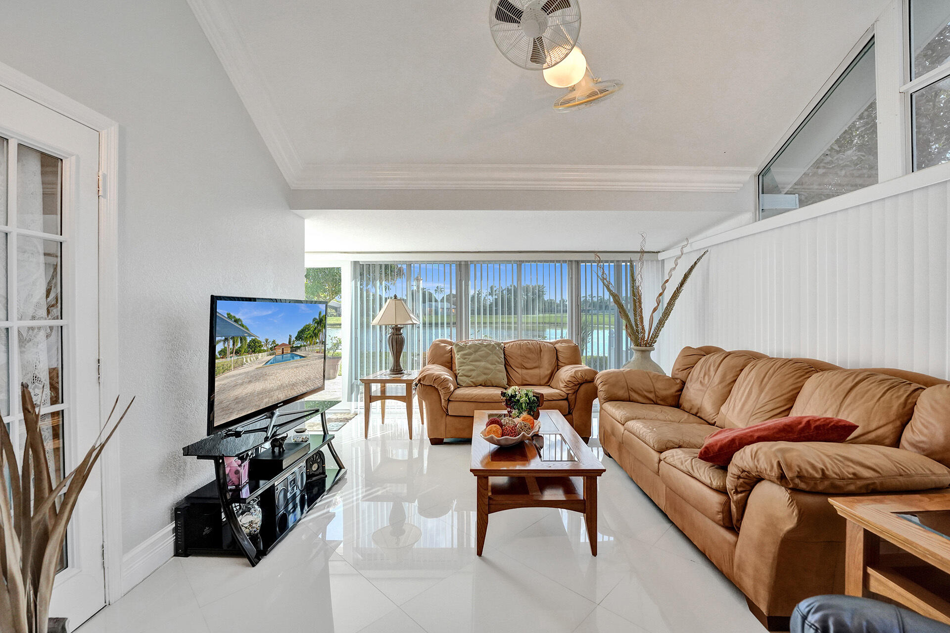 5447 Helene Circle Boynton Beach, FL 33472 - Photo 21 of 40 a living room with furniture and a flat screen tv