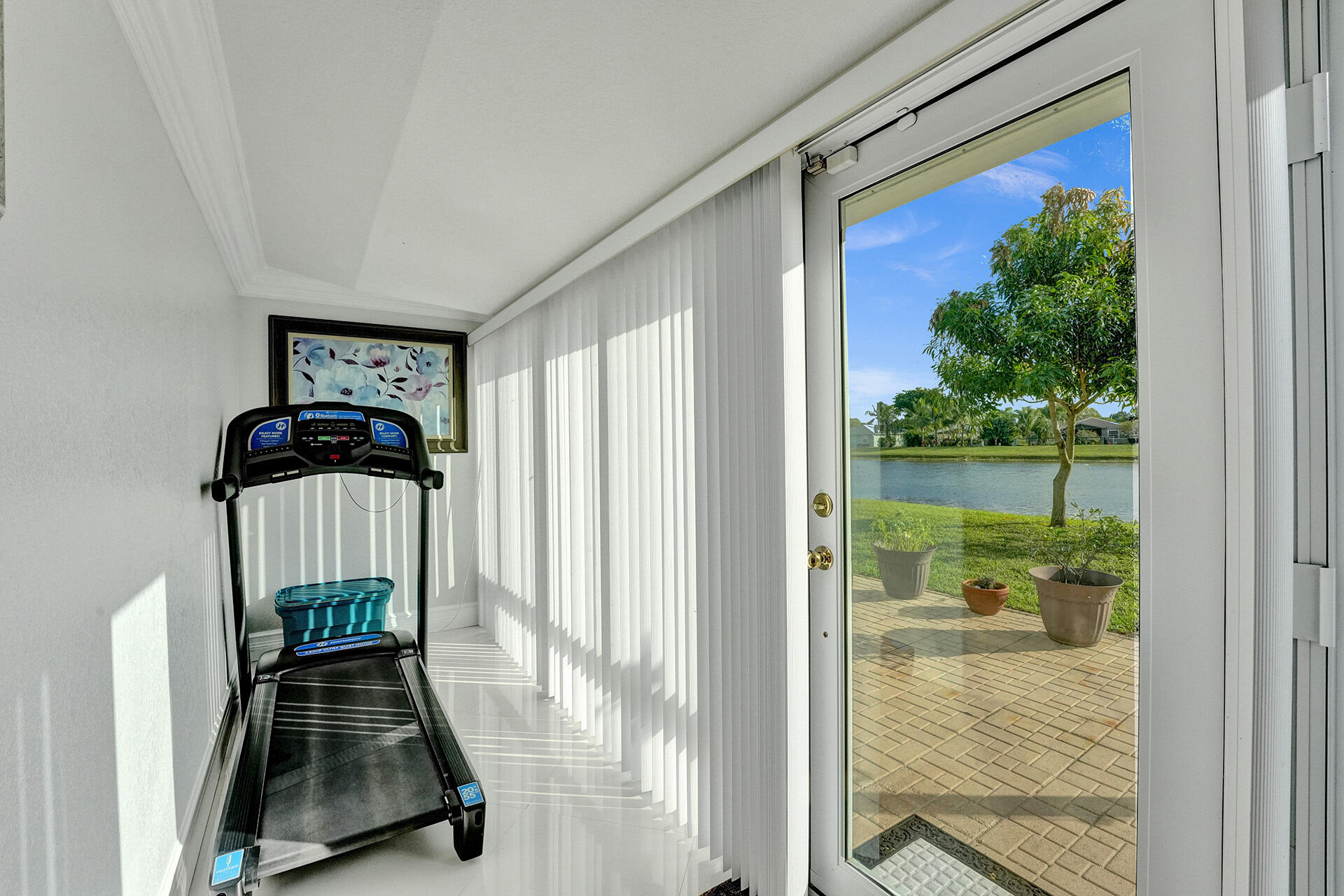 5447 Helene Circle Boynton Beach, FL 33472 - Photo 23 of 40 a view of a hallway with a door and wooden floor
