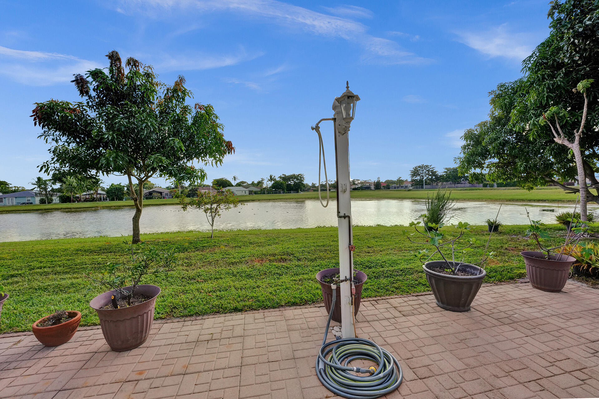 5447 Helene Circle Boynton Beach, FL 33472 - Photo 6 of 40 a view of a lake with a patio