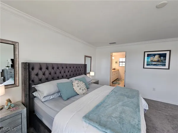 a bedroom with bed and window