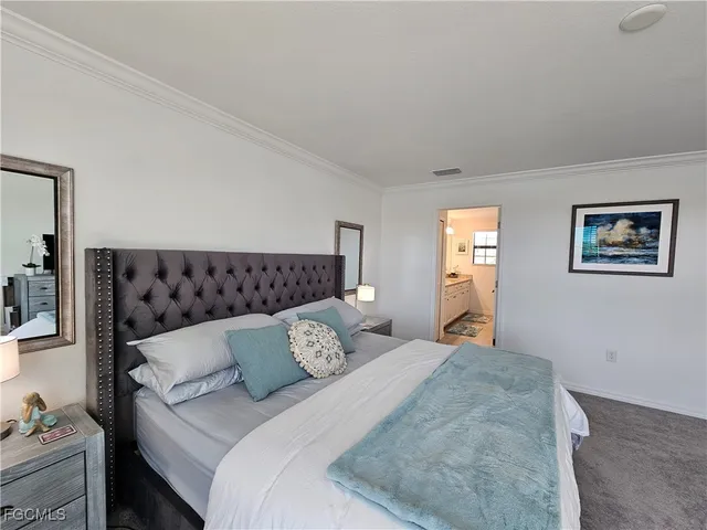 a front view of a residential apartment building with a yard