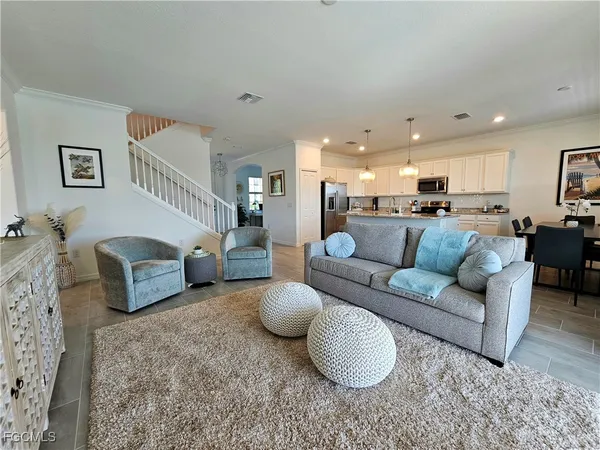 a living room with furniture and a couch