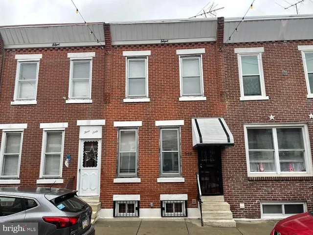 a front view of a building with glass windows