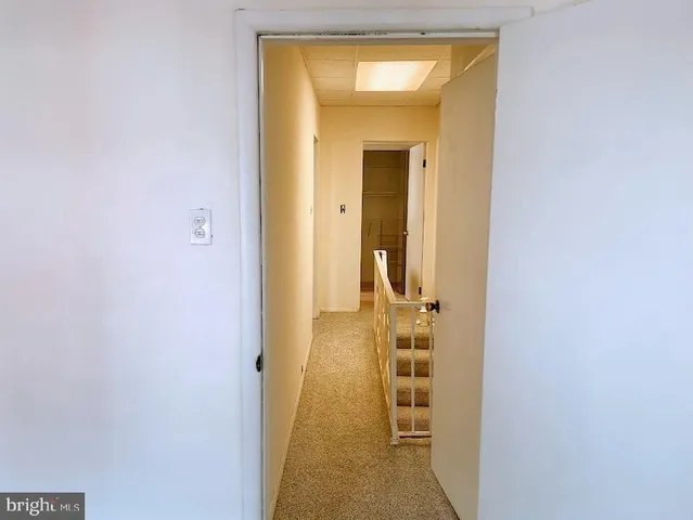 a view of bathroom with a sink and mirror