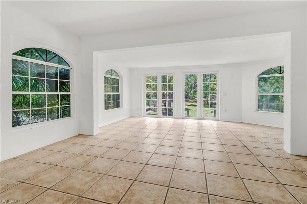 4540 Pine Ridge Road Naples, FL 34119 - Photo 14 of 30 a view of an empty room with a window