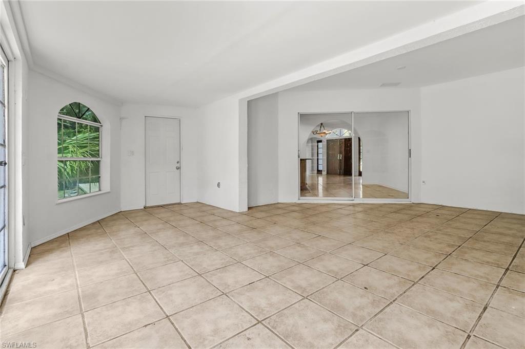 4540 Pine Ridge Road Naples, FL 34119 - Photo 15 of 30 a view of a big room with windows and closet
