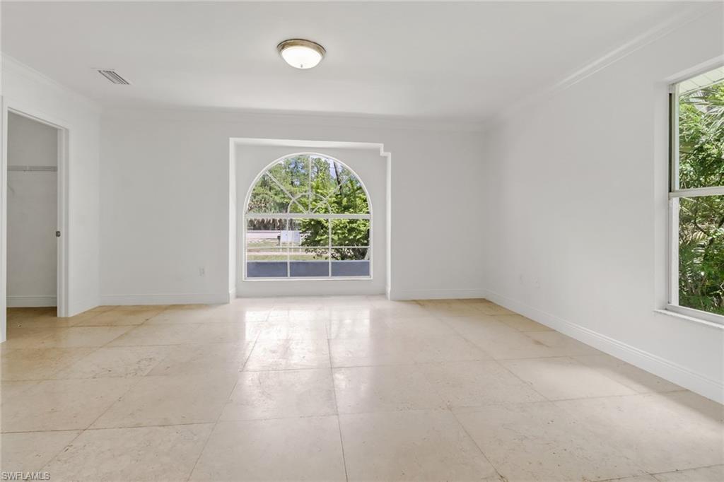 4540 Pine Ridge Road Naples, FL 34119 - Photo 18 of 30 an empty room with windows