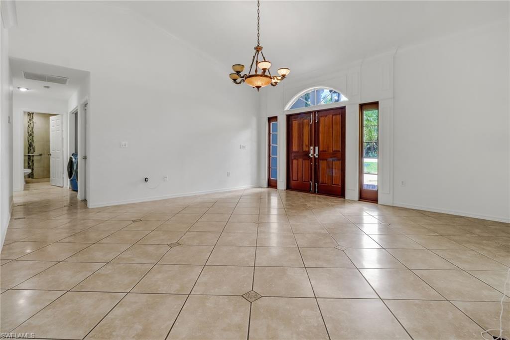 4540 Pine Ridge Road Naples, FL 34119 - Photo 5 of 30 a view of a room with a chandelier and entryway