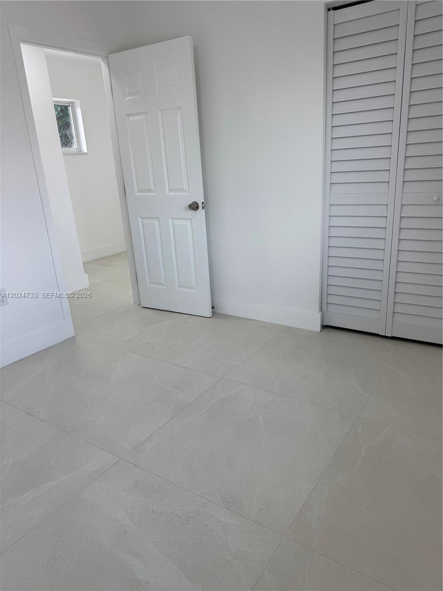 3305 Southwest 28th Street, Unit 3305 Miami, FL 33133 - Photo 13 of 17 a view of an empty room